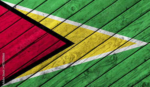 Guyana flag on wooden background. 3D image