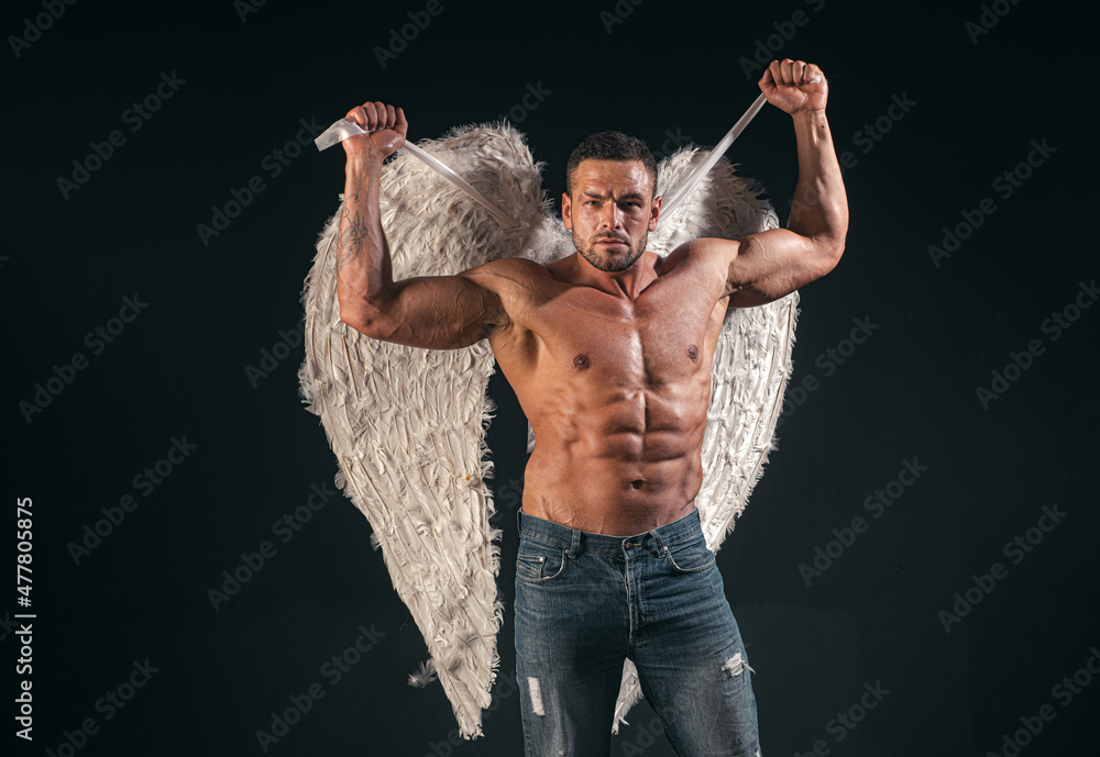 Muscle strong beautiful stripped male model valentin. Handsome sexy man with angel wings. Valentines Day, 14 February.