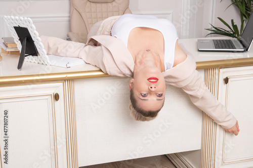 Photos Crime scene with strangled pretty business woman in office..