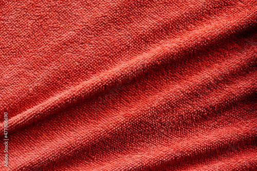 Elegant red silk, luxurious fabric texture, elegant background design. © Sai