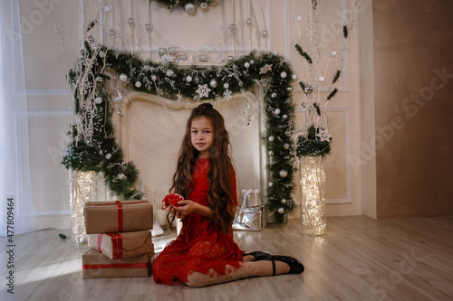 Cheerful cute little child girl with present