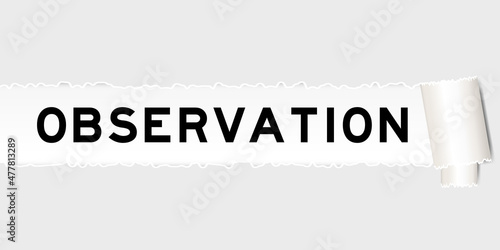 Ripped gray paper background that have word observation under torn part