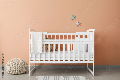 Comfortable crib in interio...
