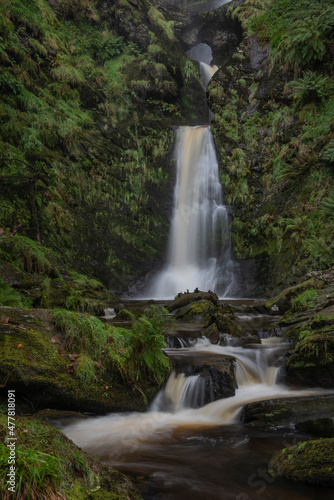 Stunning long exposure landscape early Autumn image of Pistyll Rhaeader waterfall in Wales  the tallest waterfall in UK