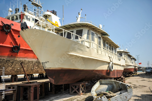 Ships and tugboat equipment for maintenance at shipyards photo