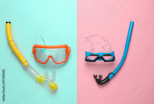 Photography Adult and child diving mask with snorkel on blue pink background