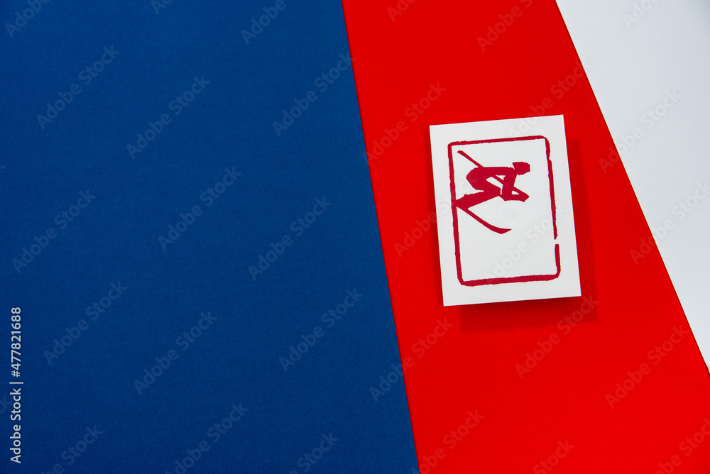 Alpine Skiing Pictogram on red background. Winter sport game in China. Wallpaper edit space. blue, Red and white colors Alpine Skiing Pictogram on red background. Winter sport game in China. Wallpaper edit space. blue, Red and white colors