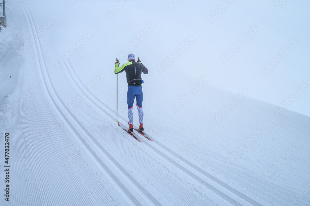 Nordic ski skier on the track in winter - sport active photo with space for your montage - Illustration picture for winter sport game
