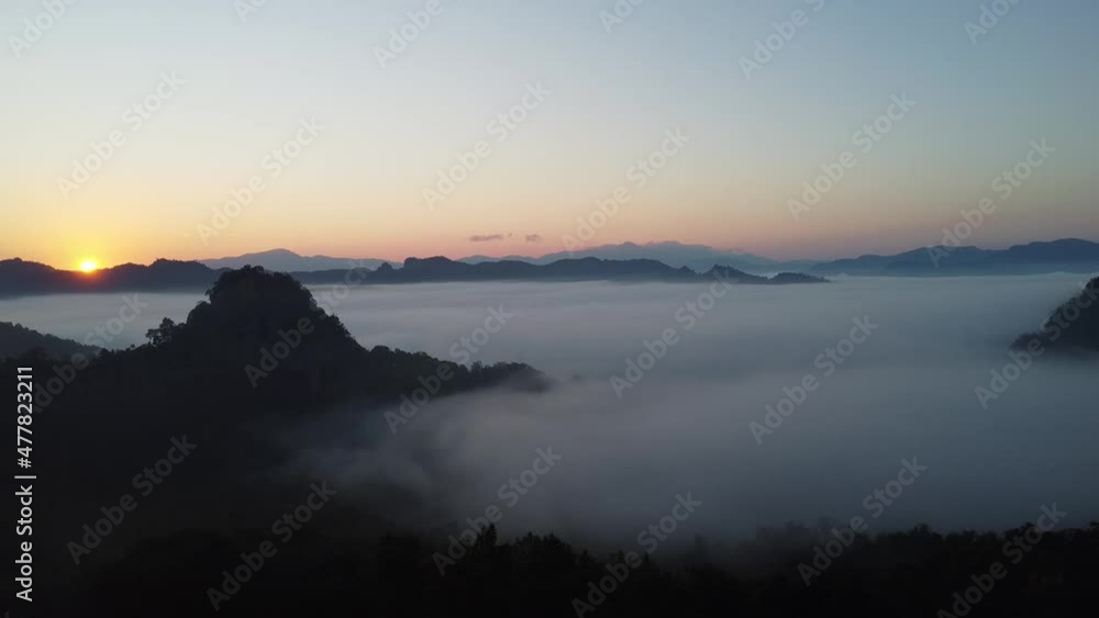 White mist or cloud scenic aerial view. Flying through the clouds and fog above mountain tops. White mist or cloud scenic aerial view. Flying through the clouds and fog above mountain tops.
