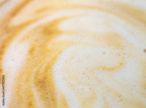 Texture surface of soft and delicate milk froth in a cup of coffee