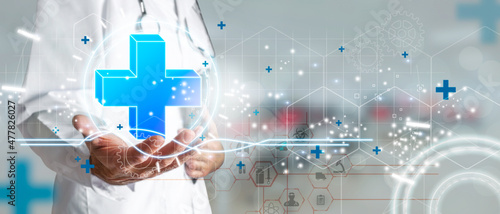 Obraz na plátně Doctor hand holding plus sign virtual as a concept of health, medical insurance and personal status