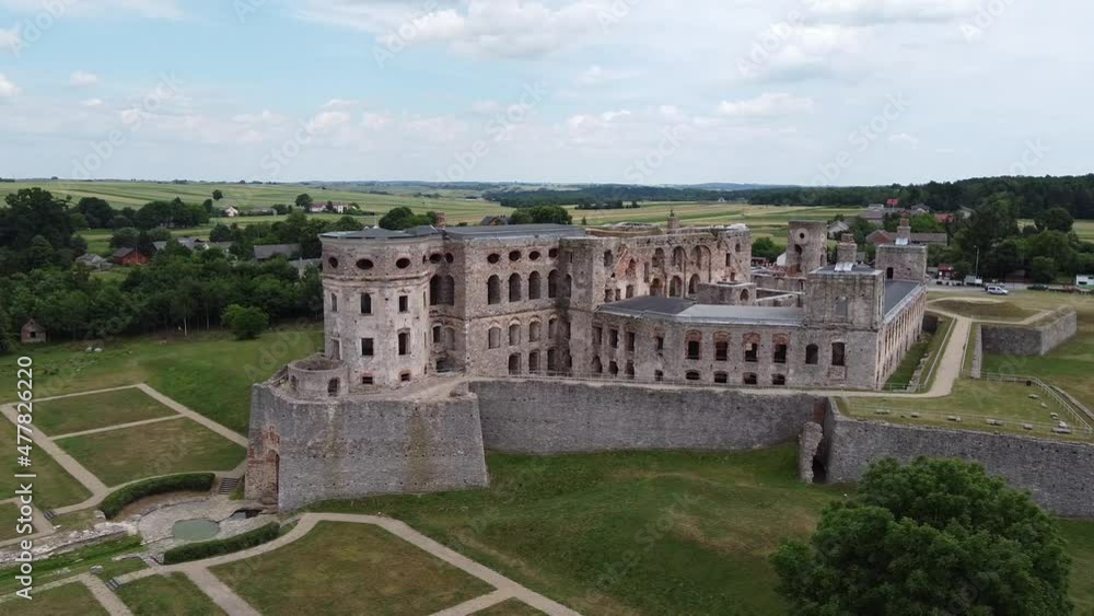 Ancient palace with a large area on the outskirts of the city. Residential buildings located around. Aerial View of Krzyztopor Castle in Poland. Ancient palace with a large area on the outskirts of the city. Residential buildings located around. Aerial View of Krzyztopor Castle in Poland.