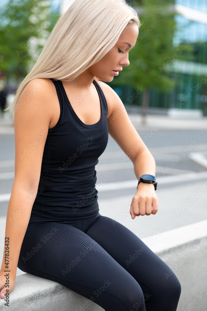 Resting Woman Checking Performance and Tracking On Smartwatch After Exercise Resting Woman Checking Performance and Tracking On Smartwatch After Exercise