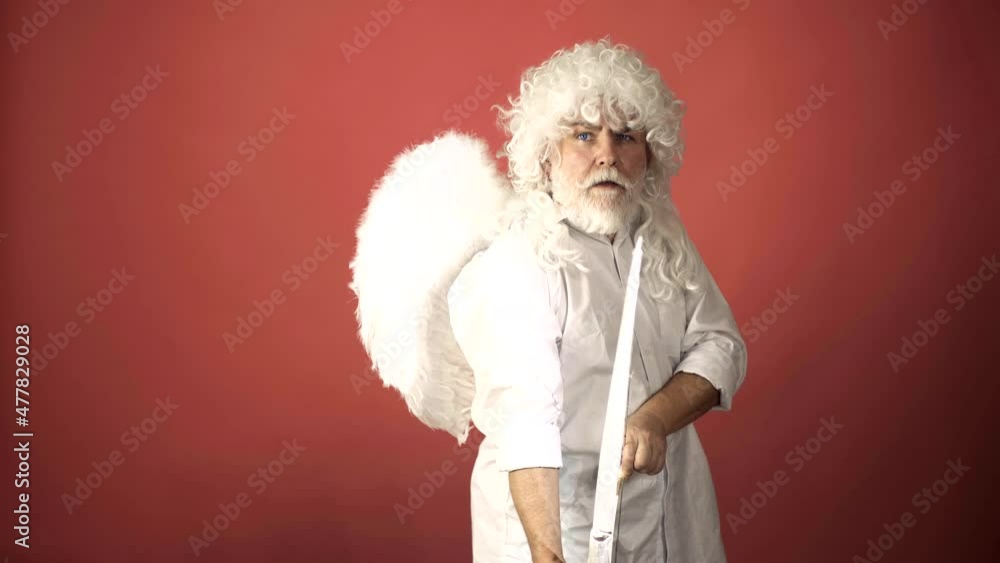 Valentine's Day concept. Funny angel cupid aiming with bow and arrow. Angels with wings holding bow and arrow. Happy valentines day. Crazy saint valentine. Valentine's Day concept. Funny angel cupid aiming with bow and arrow. Angels with wings holding bow and arrow. Happy valentines day. Crazy saint valentine.