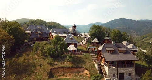 4K Aerial Footage Panoramic View of the Drvengrad, traditional wooden village in Serbia photo