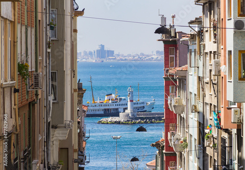 Scenic view of a boat in between two residential buildings in Kadikoy Istanbul, Turkey