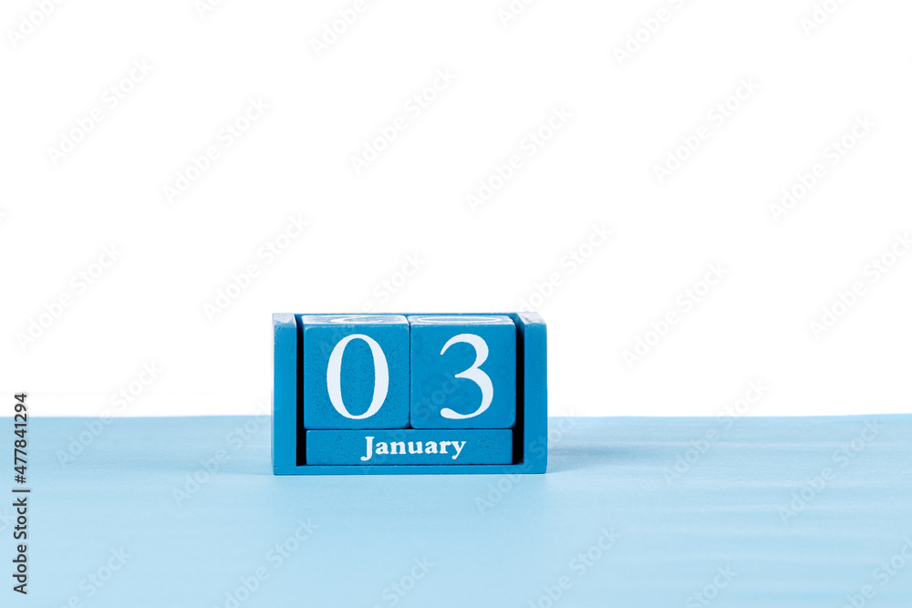 Wooden calendar January 03 on a white background Wooden calendar January 03 on a white background
