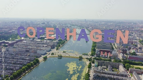 Inscription on video. Copenhagen, Denmark. Central historical part of the city, city roofs and Copenhagen lakes. Aerial view. Multicolored text appears and disappears, Aerial View, Departure of the c photo