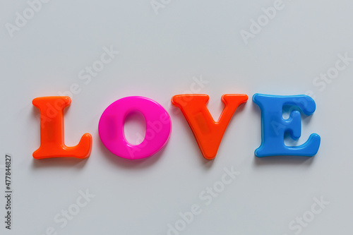 Wallpaper Mural The word HAPPY of colored magnetic letters on the learning Board.	 Torontodigital.ca