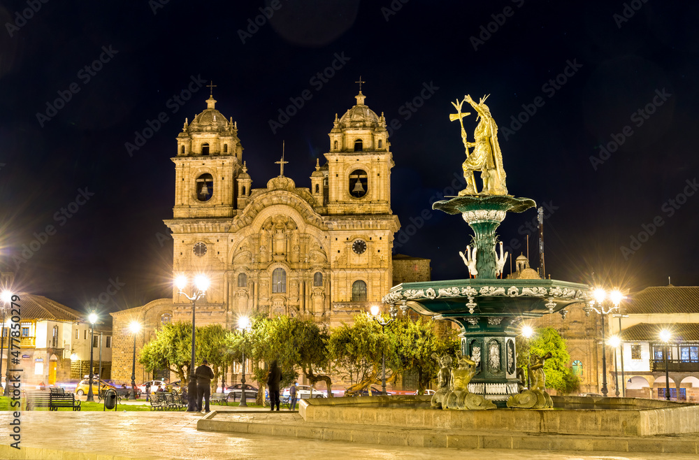 Church and statue of an Inca at the main square of Cusco in Peru