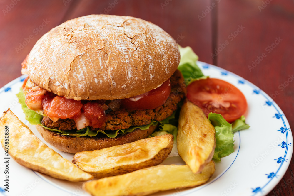 Home made vegetable burger with french fries Home made vegetable burger with french fries