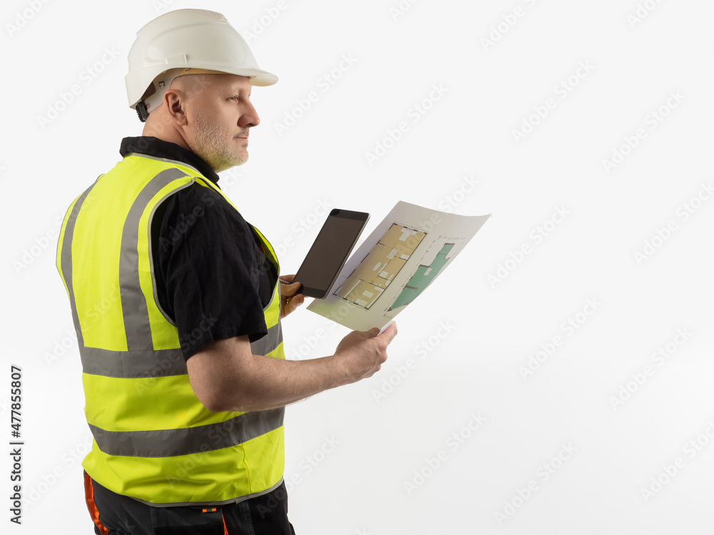 Male architect in reflective vest. Portrait of architect with construction drawings in his hands. Man in uniform builder. Employee of architectural company on white background. Architect with tablet Male architect in reflective vest. Portrait of architect with construction drawings in his hands. Man in uniform builder. Employee of architectural company on white background. Architect with tablet
