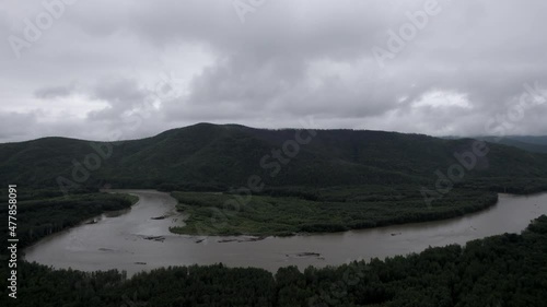 A beautiful landscape in the frame from a drone. forests and mountain river.
