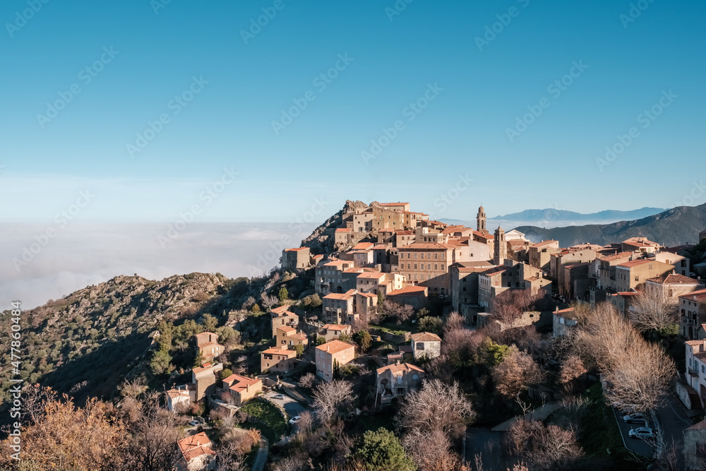 Mist hanging in the valley behind the ancient mountain village of Speloncato in the Balagne region of Corsica