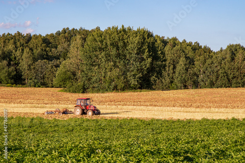 tractor plowing a field on a clear day