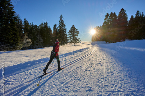 active woman, cross-country skiing Bregenz Forest Mountains near Sulzberg, Vorarlberg, Austria 