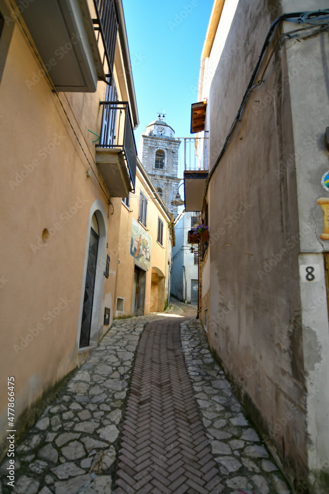 A small street between the old houses of Savoia di Lucania, a small town in the province of Potenza in Basilicata, Italy.	
