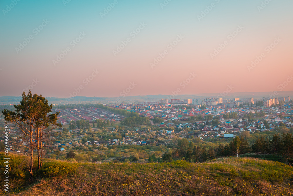 City, view from the mountain. Beautiful summer sunset.