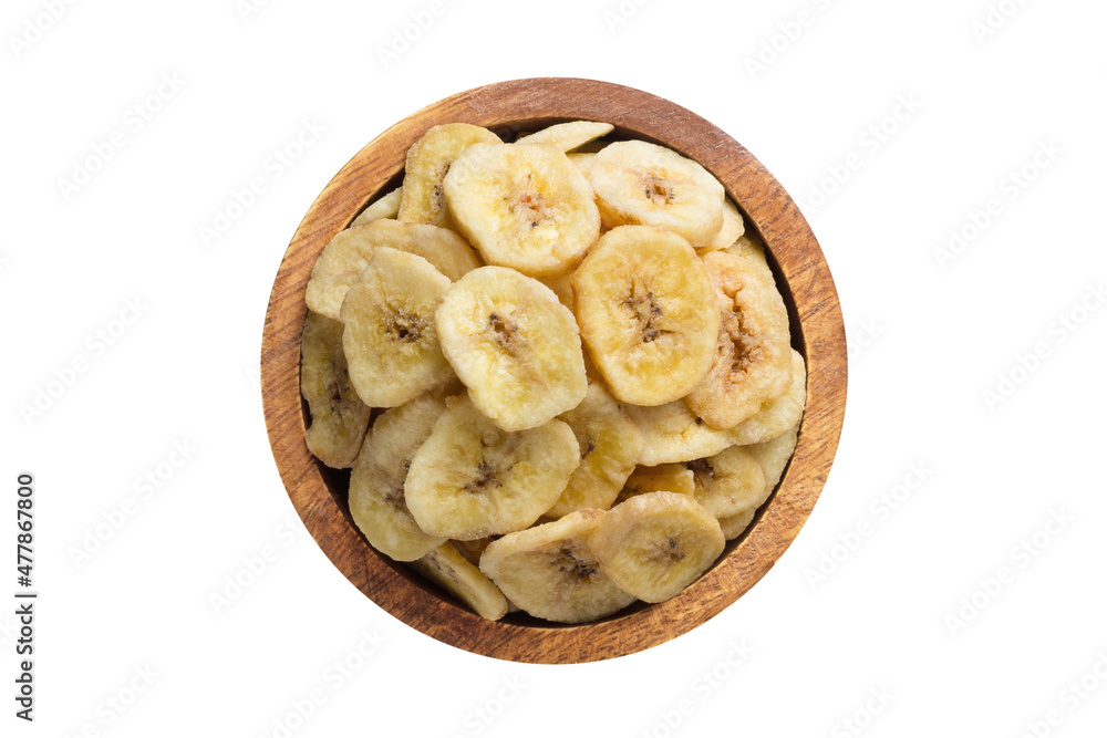 dried fruit, banana chips in wooden bowl isolated on white background. Vegan food, top view. dried fruit, banana chips in wooden bowl isolated on white background. Vegan food, top view.