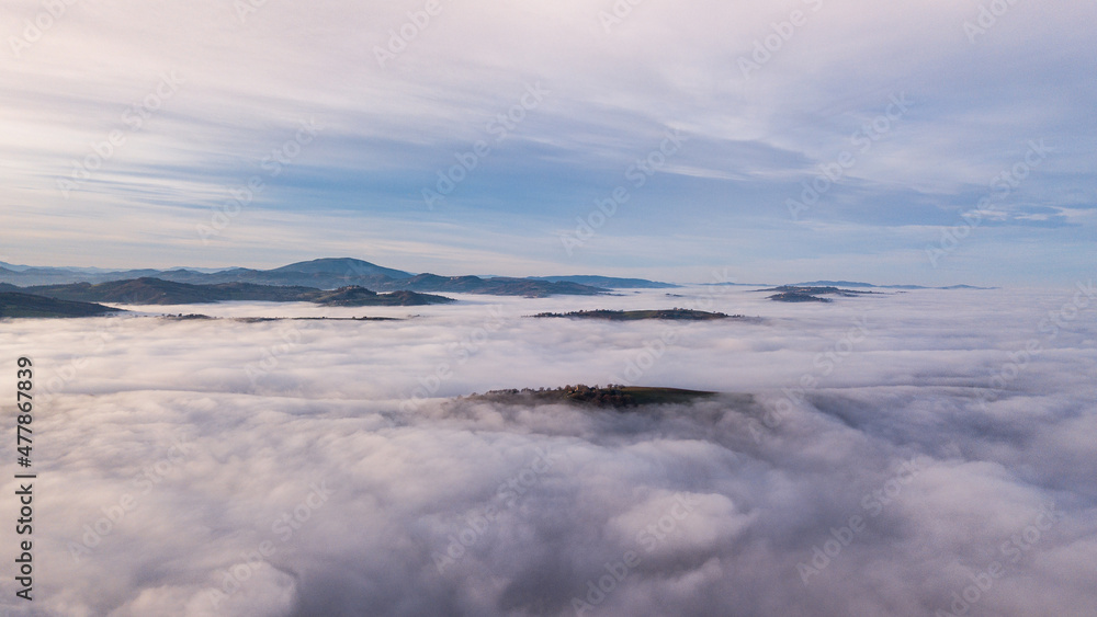 aerial view of landscape surrounded by fog