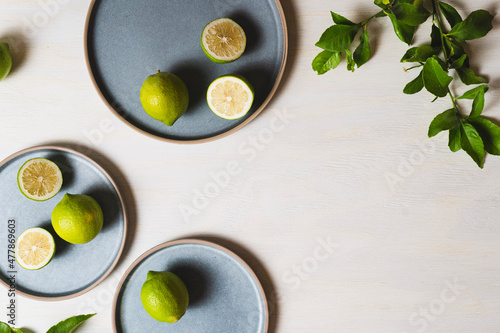 Lemons on blue plates and wood background - Flat lay