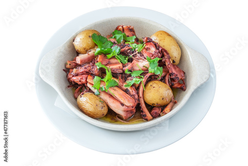 Traditional Portuguese dish of octopus and potatoes called polvo a lagareiro close-up on a white plate photo