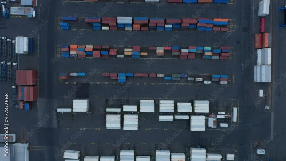 Overhead view of lots of containers stocked at Sundahofn cargo harbor in east side of Reykjavik. Top down view of commercial international logistic containers full of good ready to be delivered Overhead view of lots of containers stocked at Sundahofn cargo harbor in east side of Reykjavik. Top down view of commercial international logistic containers full of good ready to be delivered