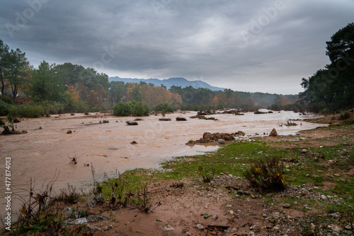 Fototapeta Naklejka Na Ścianę i Meble -  Abnormal rainy weather, storm is post- flood, overflowing stream after heavy rain. Flood area and Climate change. 4K video, 01.January.2022 Antalya - TURKEY