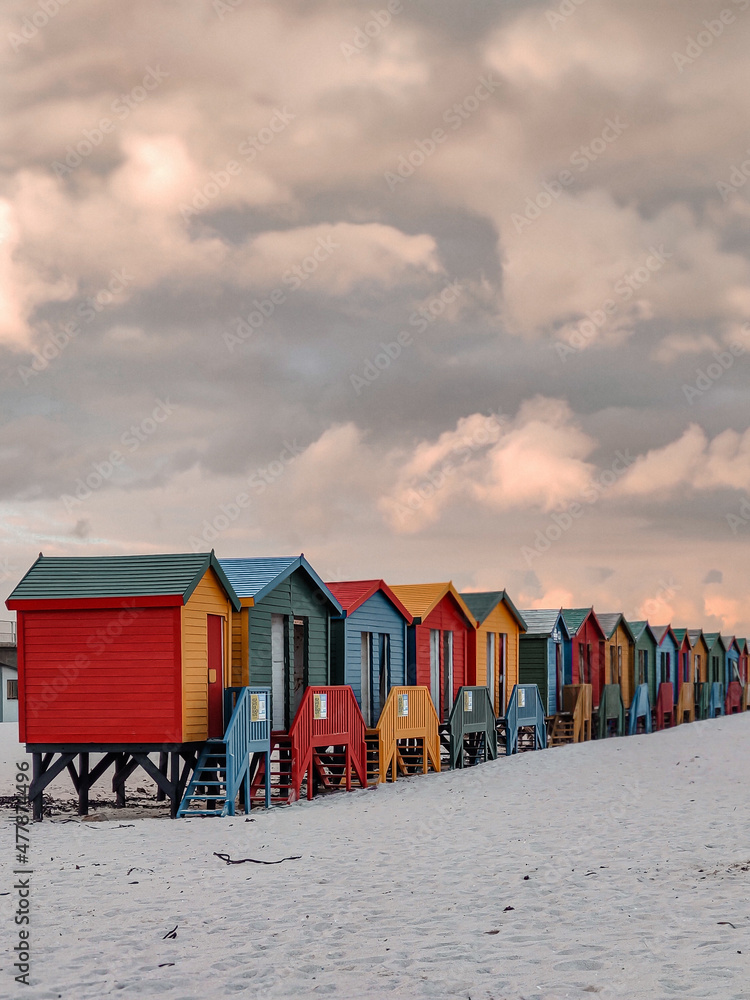 Naklejka premium beach huts at sunset