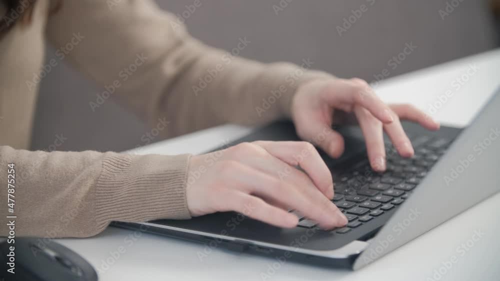 Freelancer woman typing on computer keyboard in close up stock video. Professional businesswoman working from home on notebook. Female doing distant work and networking on laptop Freelancer woman typing on computer keyboard in close up stock video. Professional businesswoman working from home on notebook. Female doing distant work and networking on laptop