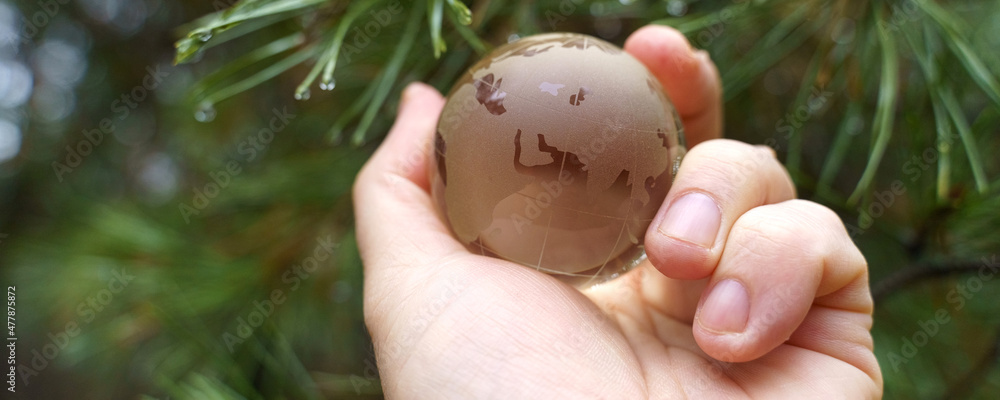 World earth day. Hands are holding a glass planet. World earth day. Hands are holding a glass planet.