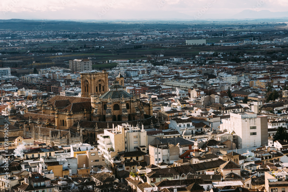 The Granada Cathedral in the middle of the city with the Cathedral, seen from the Candle Tower in the Alcabaza