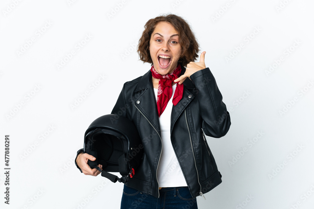 English woman holding a motorcycle helmet isolated on white background making phone gesture. Call me back sign English woman holding a motorcycle helmet isolated on white background making phone gesture. Call me back sign