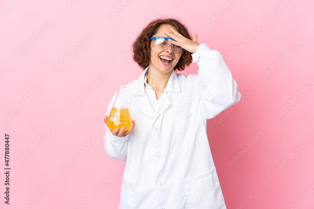 Young English scientific woman isolated on pink background smiling a lot Young English scientific woman isolated on pink background smiling a lot