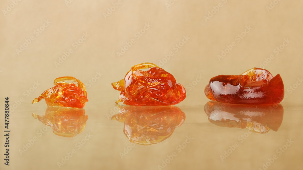 3 pieces of cannabis wax clsoeup. concentrate dab with high thc 3 pieces of cannabis wax clsoeup. concentrate dab with high thc