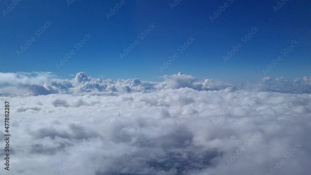 Video of passing through different cloud layers during descent of airplane during daytime Video of passing through different cloud layers during descent of airplane during daytime