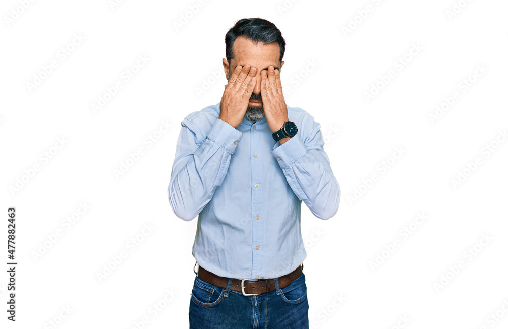 Middle aged man with beard wearing business shirt rubbing eyes for fatigue and headache, sleepy and tired expression. vision problem Middle aged man with beard wearing business shirt rubbing eyes for fatigue and headache, sleepy and tired expression. vision problem
