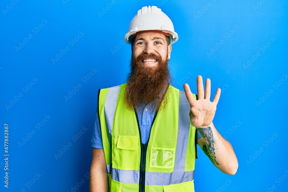 Redhead man with long beard wearing safety helmet and reflective jacket showing and pointing up with fingers number four while smiling confident and happy. Redhead man with long beard wearing safety helmet and reflective jacket showing and pointing up with fingers number four while smiling confident and happy.