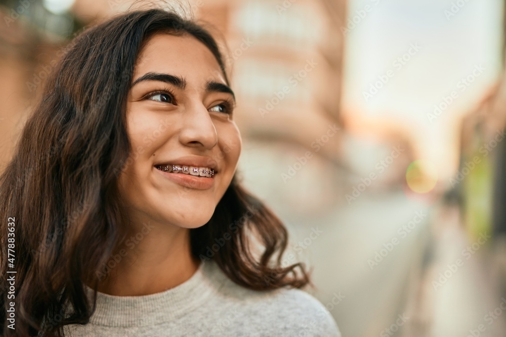 Fototapeta premium Young middle east girl smiling happy standing at the city.
