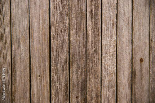 Brown or gray wood texture. Abstract background. rustic background of old wooden boards with holes and nails.